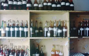 Concoctions: Colour photo of bottles of muti on shelves inside