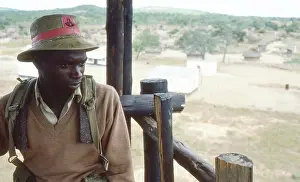 Zanu: Colour photo of guard in gun tower at a protected