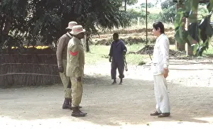 Zanu: Colour photo of guards at a protected village;