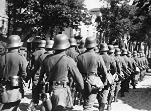 Knapsacks: Column of German soldiers in a garrison town