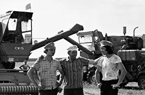 Coworkers: Combine operator Nikolai Meshkov with sons