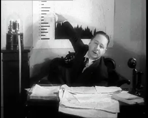 Graph: Comedian Robert Benchley Pointing to a Graph