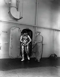 Exiting: Commander Malcom D. Ross in his space suit