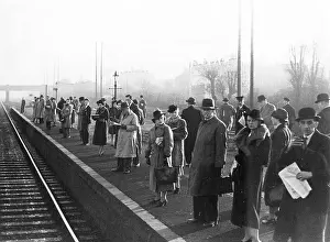 Impatiently: COMMUTERS AWAIT TRAIN