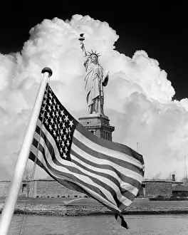 Overlay: Composite Image of Statue of Liberty with Dramatic