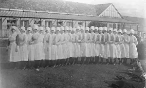 Wellbeing: ?Conga? line of 25 nurses, outside single-storey building