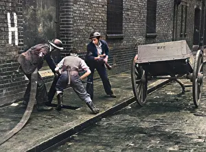 Cobbles: Connecting up a hosepipe during the Blitz