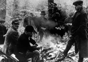 Campfire: Conscripted workers during a break, 1944
