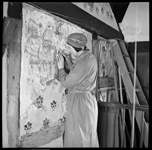 Conservator: Conservator restoring a medieval wall painting