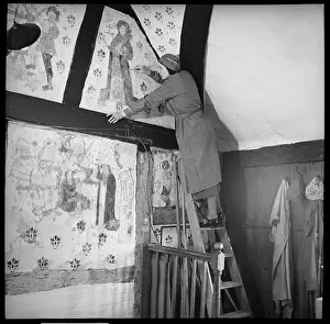 Conservator: Conservator restoring a medieval wall painting