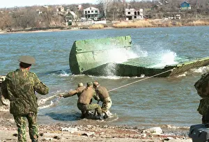 Construction of pontoon bridge during military