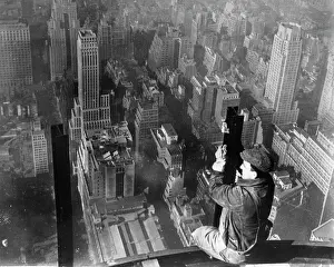 Vertigo: Construction worker looking over New York