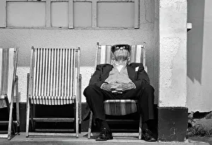 Snooze: Cool old man in seaside shelter