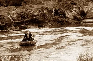 Coracle: Coracle on River Teifi at Cenarth, Wales probably 1930s