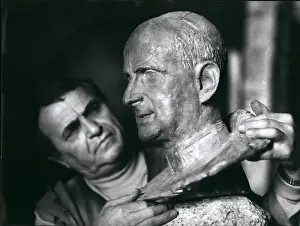 Signor: Corrado Ruffini, sculptor, working on Vatican coins, Rome