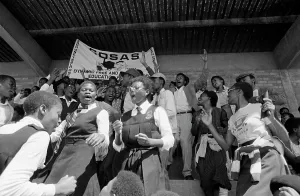 Cosas: COSAS banner and students at a mass funeral after four