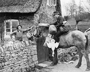 Parcel: Cotswolds postman delivering parcel, 1938
