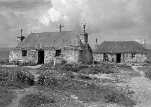 Thatching: Cottage buildings in remote landscape