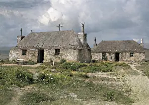 Thatching: Cottage buildings in remote landscape