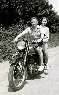 Pillion: Couple on a 152 BSA motorcycle