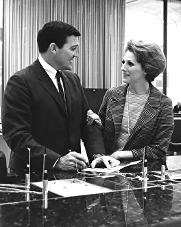 Nicely: Couple At a Bank Counter