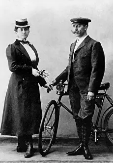 Cyclists: Couple with bicycle, around the 1900s