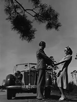 Wanderer: Couple in front of car, 1938