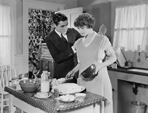 Supportive: Couple cooking in the kitchen