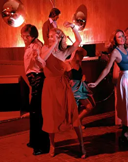 Discotheque: COUPLE DANCING IN DISCOTHEQUE INDOOR