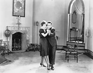 Fireplaces: Couple dancing in their living room