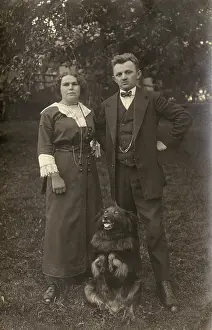 Cuffs: Couple and dog in a garden