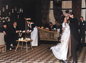 Maids: A couple dressed in their finery, dancing