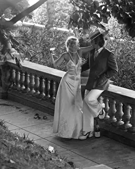 Boater: COUPLE DRINK ON VERANDA