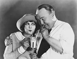 Straws: Couple drinking beverage with straw