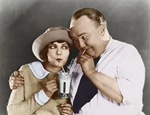 Straws: Couple drinking beverage with straw