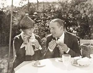 Indulgence: Couple eating ice cream and cake