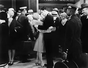 Infatuated: Couple embracing at a train station