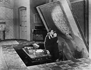 Structural: Couple emerging from hidden room