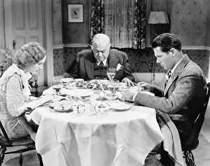 Foodstuff: Couple with their father sitting at the dining table