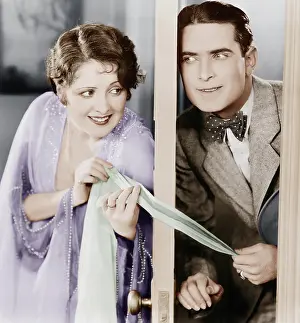 Flirtatious: Couple flirting through a slightly open door