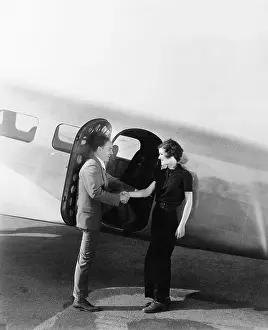 Runways: Couple greeting each other at a small airplane