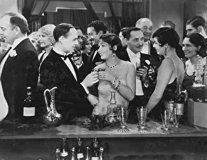 Jmlook: Couple having drink at crowded bar