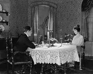Candlelit: Couple having formal dinner at home