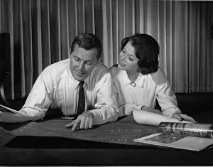 Blueprints: Couple indoors looking at blueprints