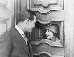 Excite: Couple interacting through hole in door