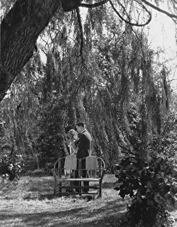 Involve: Couple kissing in the garden