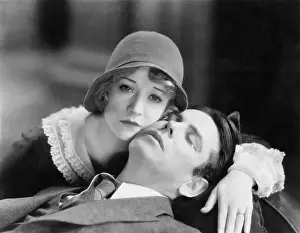 Consoling: Couple leaning on each other and crying