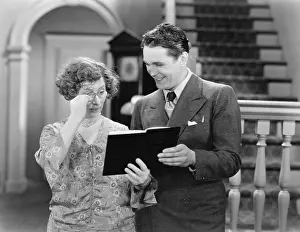 Corridors: Couple looking at a book together