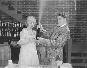 Accidentally: Couple looking at spraying bottle