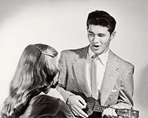 Cle003: Couple Man Wearing Suit and Tie Singing Playing